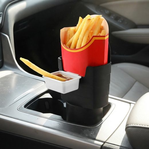 Red car french fry holder inserted into a cup holder, filled with golden fries.