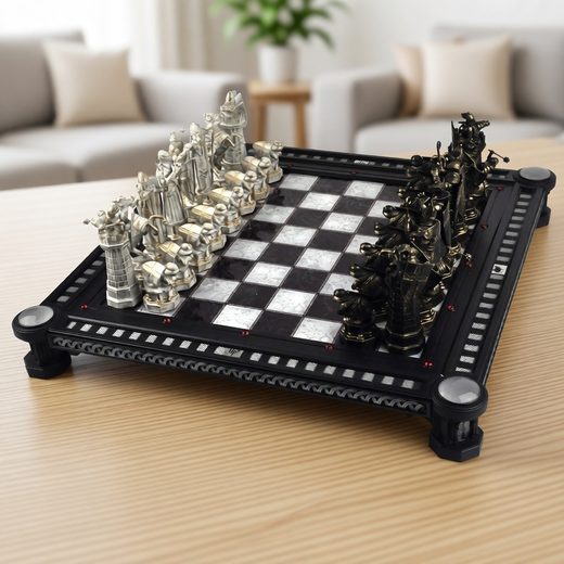 Movie replica Harry Potter chess set featuring detailed wizard pieces on a black and white board.