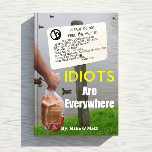 Hand holding bread near a book cover featuring a humorous wildlife warning sign in a grassy setting.
