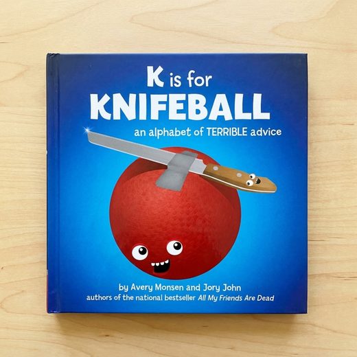 Hardcover book cover showing a red ball impaled by a knife, titled K is for Knifeball.