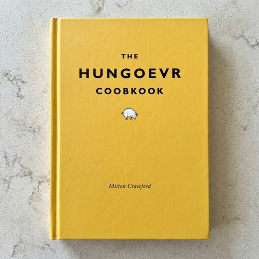 Bright mustard yellow cookbook cover titled The Hungover Cookbook with a small illustration.