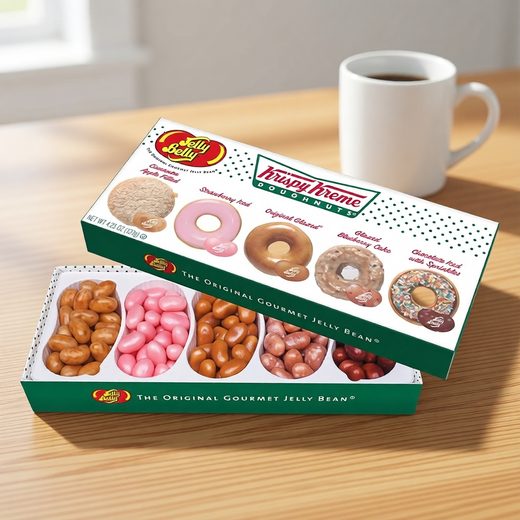 Green and white box filled with assorted jelly beans, some shaped like doughnuts.