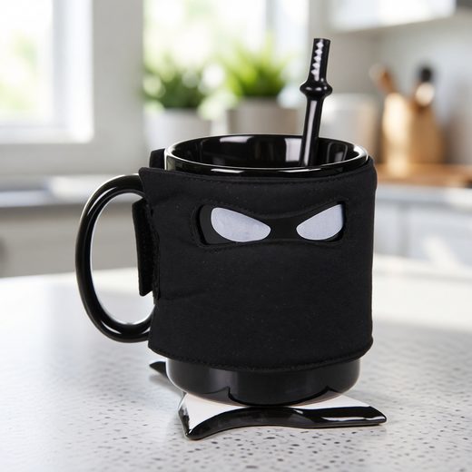 Black ninja-themed coffee mug with a mask design, sword spoon, and coaster.