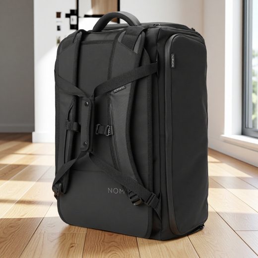Black convertible travel pack shown as a rolling suitcase with external straps and handles.