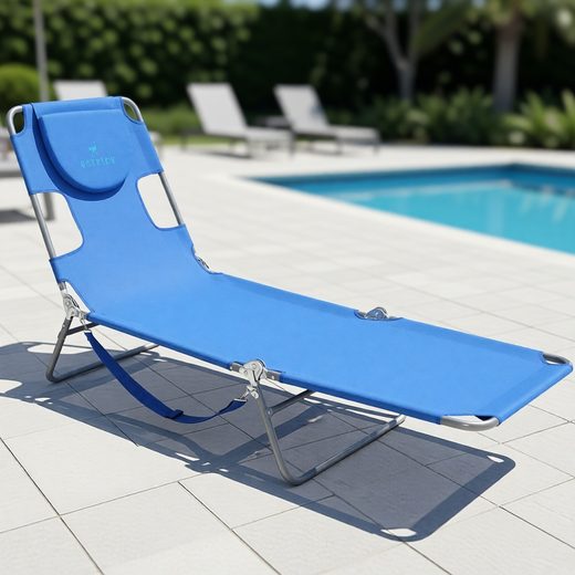 Bright blue adjustable beach lounger with metal frame resting on a poolside patio.