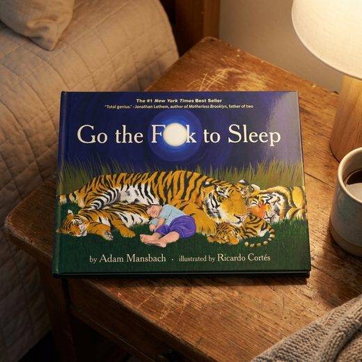 Book cover featuring a large illustration of several tigers sleeping in tall green grass.