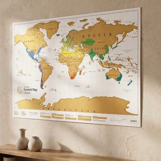 Large scratchable world map featuring gold foil for tracking travel destinations and countries.
