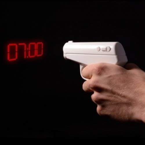 White tactical alarm clock projecting bright red digital time onto a dark background.