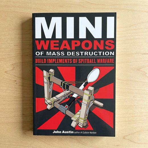 Book cover displaying a crude wooden siege weapon blueprint for spitball warfare.