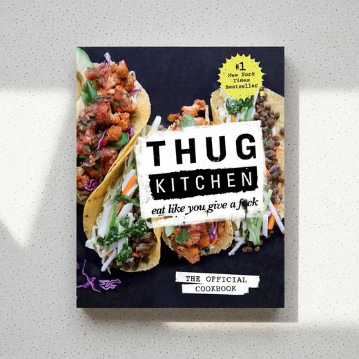 Thug Kitchen cookbook cover displaying colorful, spicy tacos and bold black typography.